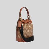 COACH Dempsey Drawstring Bucket Bag 15 In Signature Canvas With Snowflake Print Khaki Multi CE587