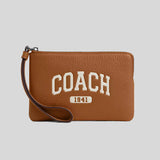 COACH Corner Zip Wristlet With Varsity Silver/Light Saddle CR393